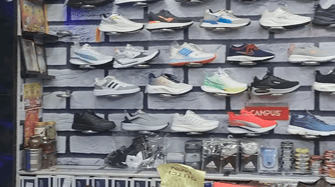 Footwear display inside Nitin Shoes, Nirman Nagar Jaipur showcasing quality shoes, slippers and sandals for men, women and kids