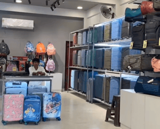 Elegant interior of Mona Bags-Luxe store in Shyam Nagar Jaipur showcasing handbags, travel bags, and kids essentials